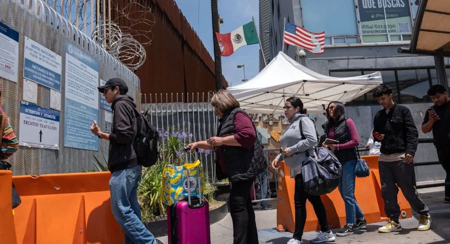 A line of immigrants crossing the point of control